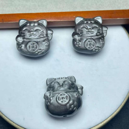 Silver obsidian fortune cat carved through the hole, the specification is about 27mm, the special price is 12 US dollars/piece